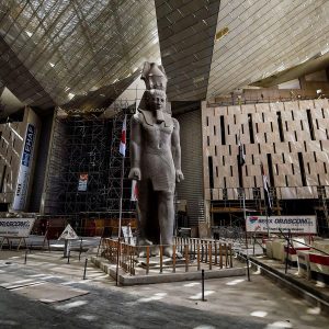 the detailed carvings on a Ramesses statue inside the Grand Egyptian Museum