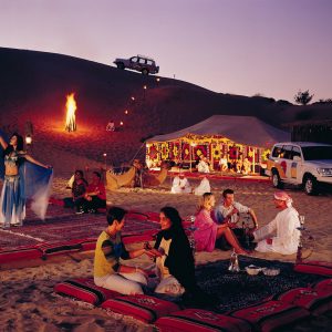 A group of tourists on a desert safari tour