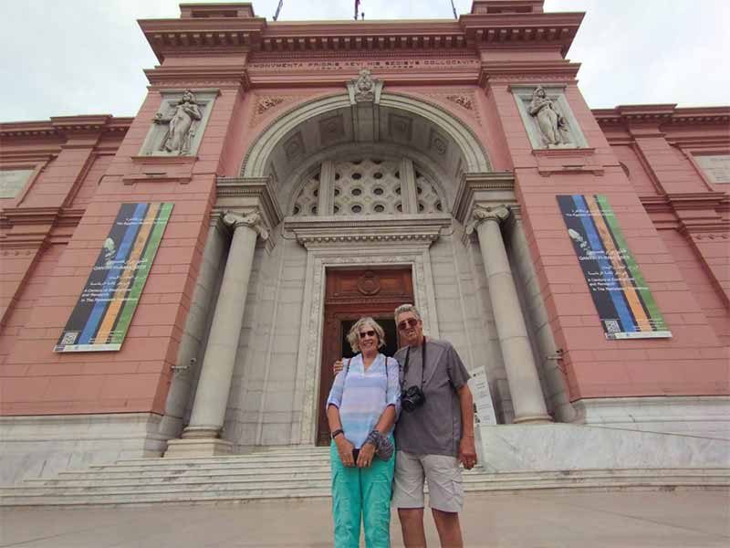  A couple posing for a photo outside the Egyptian Museum before exploring its treasures 